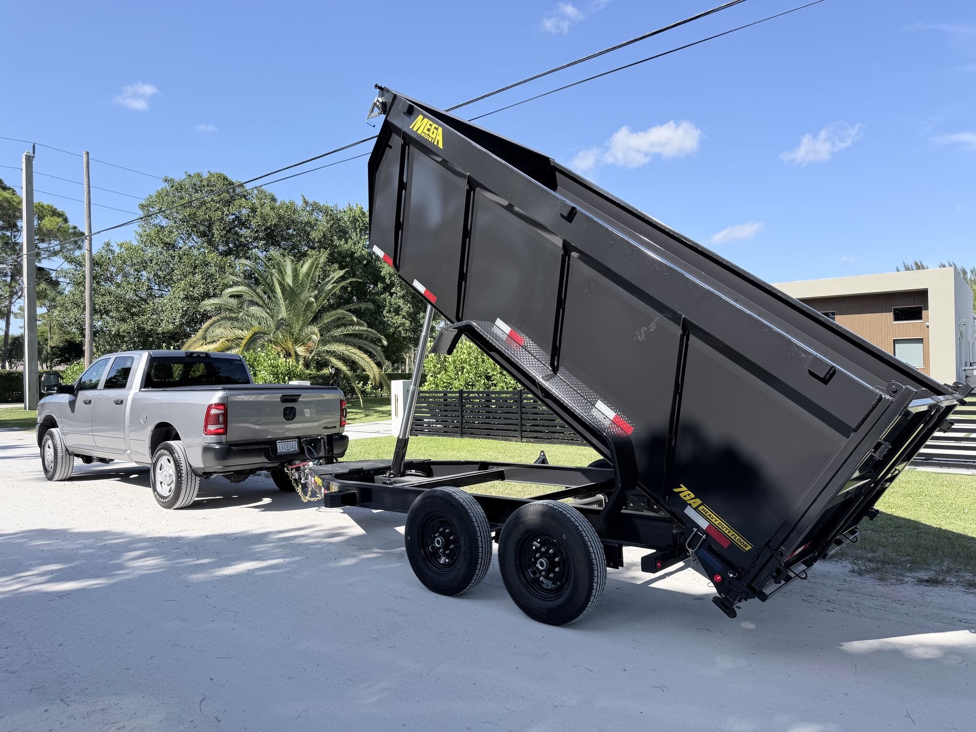 Nearby Solutions truck with the dump trailer raised
